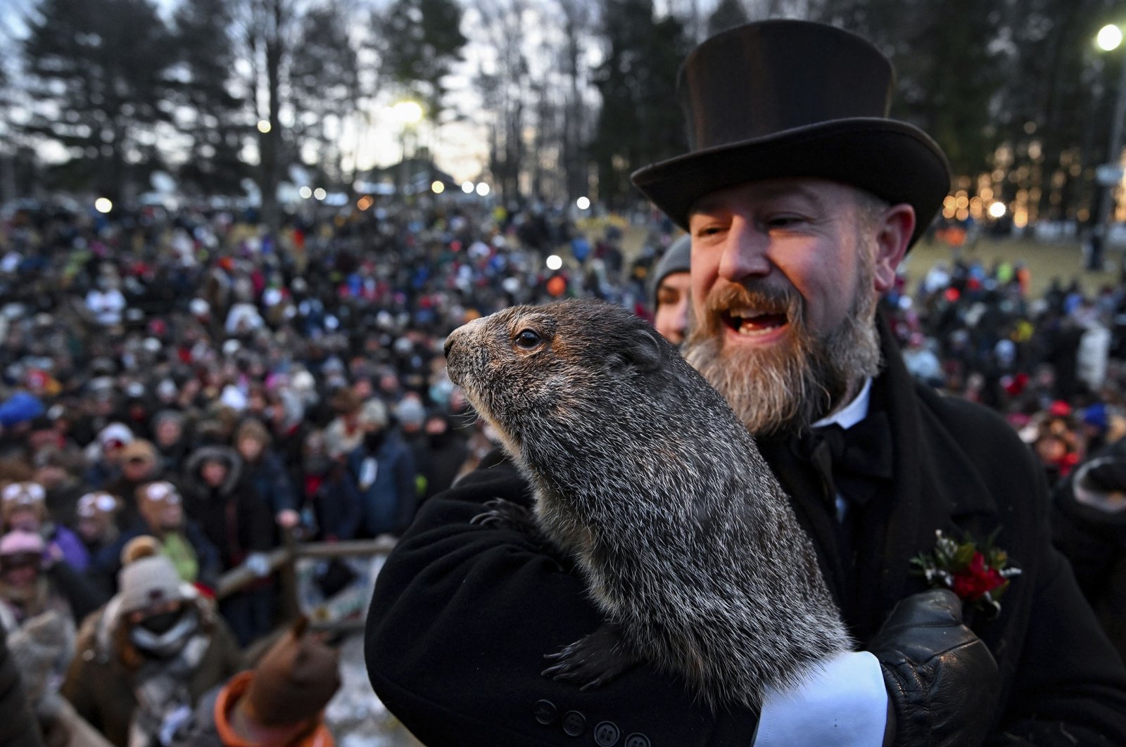 Groundhog Club handler A.J. Dereume holds Punxsutawney Phil, the weather prognosticating groundhog, during the 136th celebration of Groundhog Day on Gobbler&#039;s Knob in Punxsutawney, Pennsylvania, U.S., Feb. 2, 2022. (AP Photo)