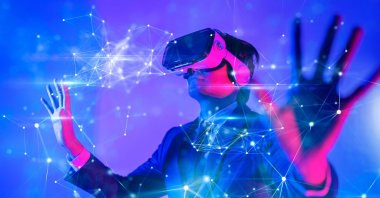 A man with virtual reality goggles plays an augmented reality game in this undated illustration photo. (Shutterstock Photo)