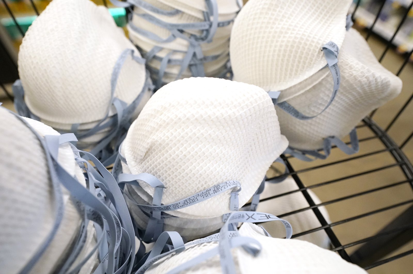 A product stall filled with free N95 respirator masks, provided by the U.S. Department of Health and Human Services, sits outside a pharmacy at a grocery store in Mississippi, U.S., Feb. 2, 2022. (AP Photo)