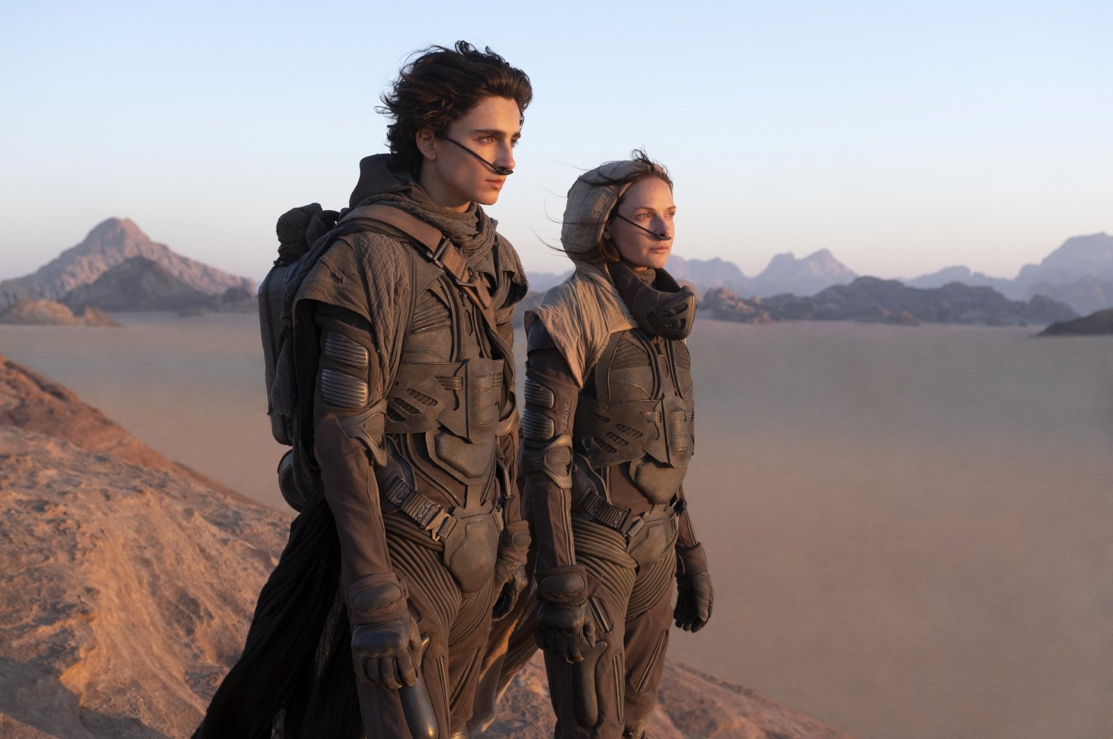 This image released by Warner Bros. Pictures shows Timothee Chalamet (L) and Rebecca Ferguson in a scene from &quot;Dune.&quot; (AP)