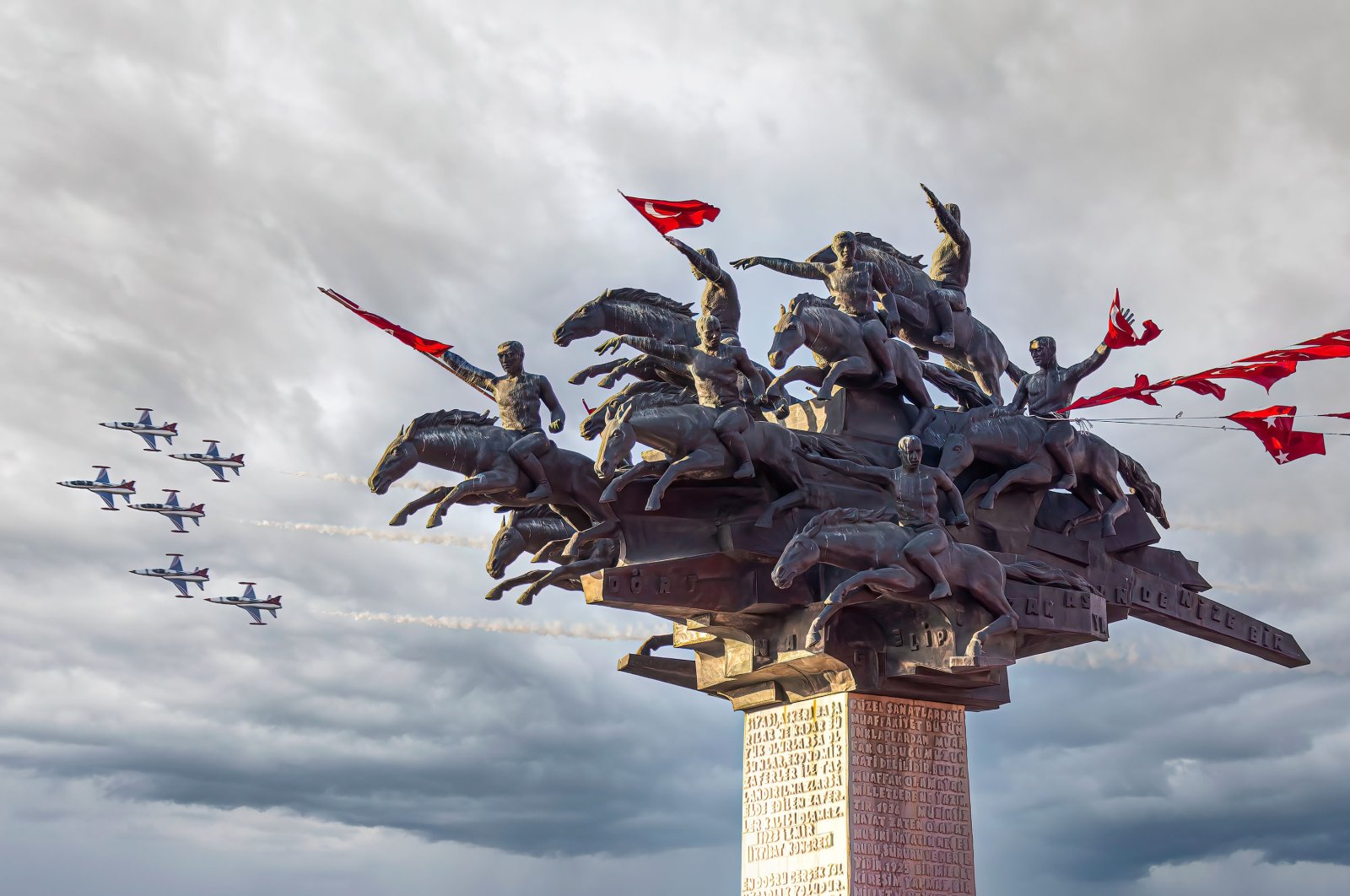 The Tree of the Republic statue built to commemorate the 80th anniversary of the Republic of Turkey is seen as Turkish jets carry out a demonstration flight on the anniversary of Izmir&#039;s liberation from Greek occupation forces on Sept. 9, 1922, in the Kordon district, Izmir, western Turkey, Sept. 9, 2019. (Photo by Shutterstock)