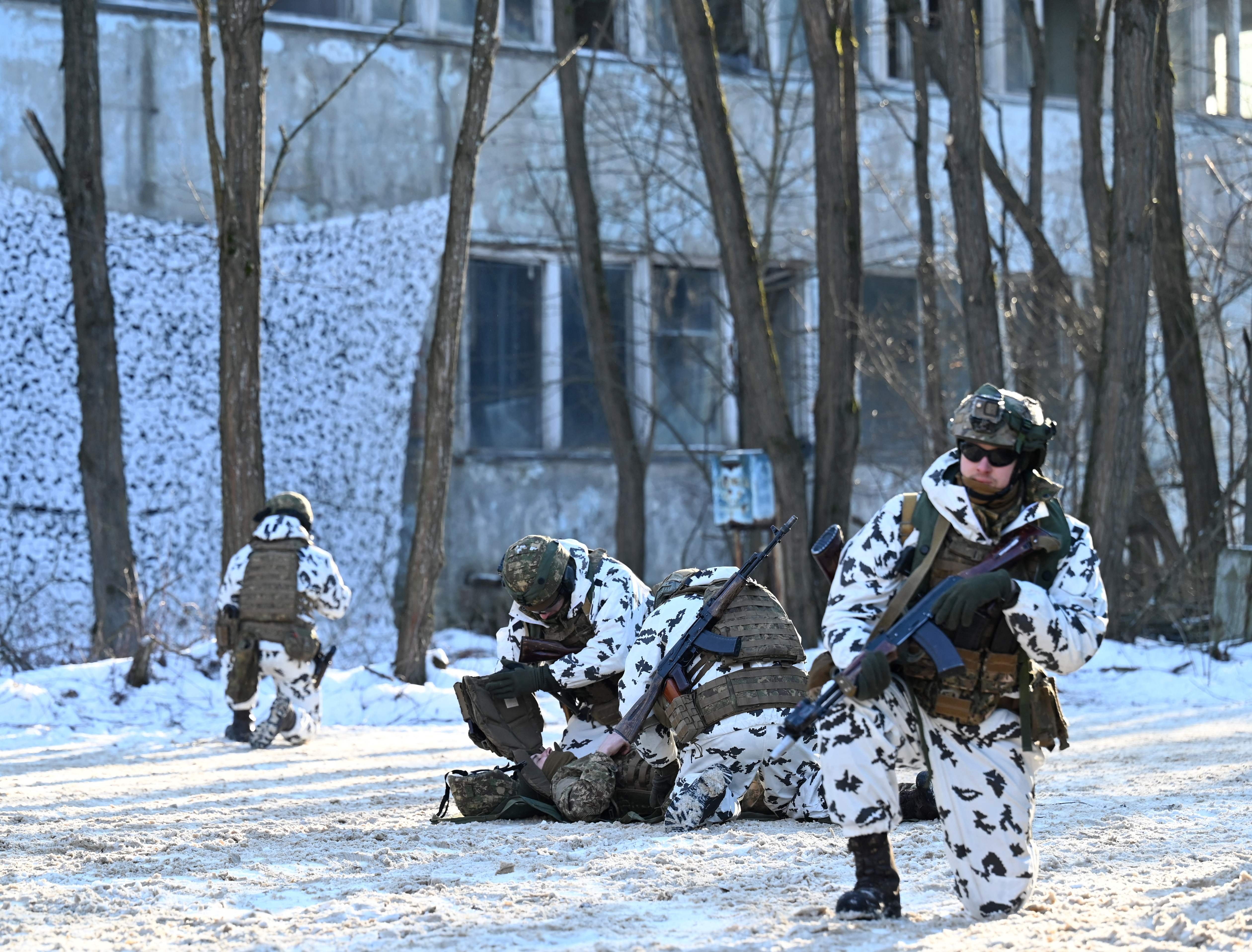 Service members take part in joint tactical and special exercises of the Ukrainian Ministry of Internal Affairs, the Ukrainian National Guard and Ministry Emergency in a ghost city of Pripyat, near Chernobyl Nuclear Power Plant, Ukraine, Feb. 4, 2022. (Photo via AFP)