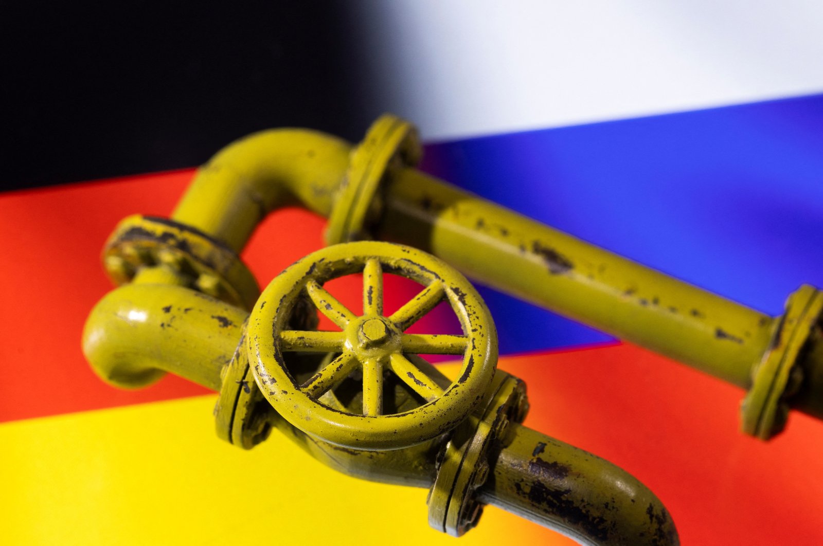 3D printed natural gas pipes are displayed on German and Russian flags, Jan. 31, 2022. (Reuters Photo)