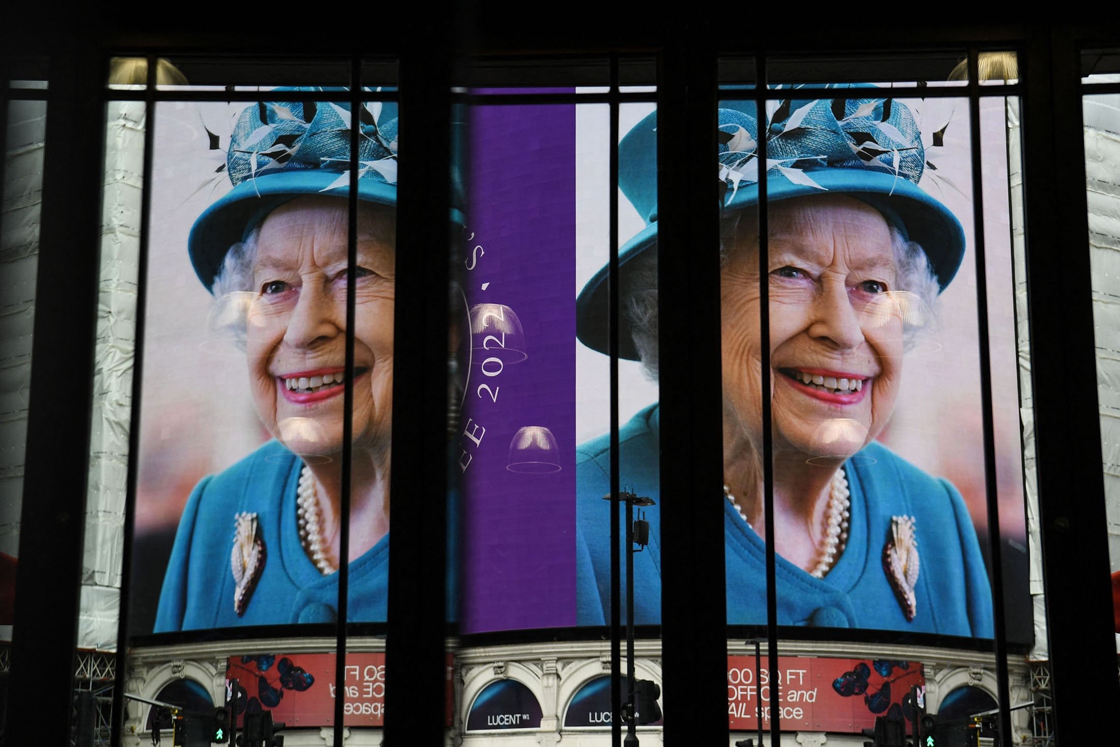 Images of Queen Elizabeth II are displayed on the big digital screens at Piccadilly Circus in central London, U.K., Feb. 6, 2022. (AFP Photo)