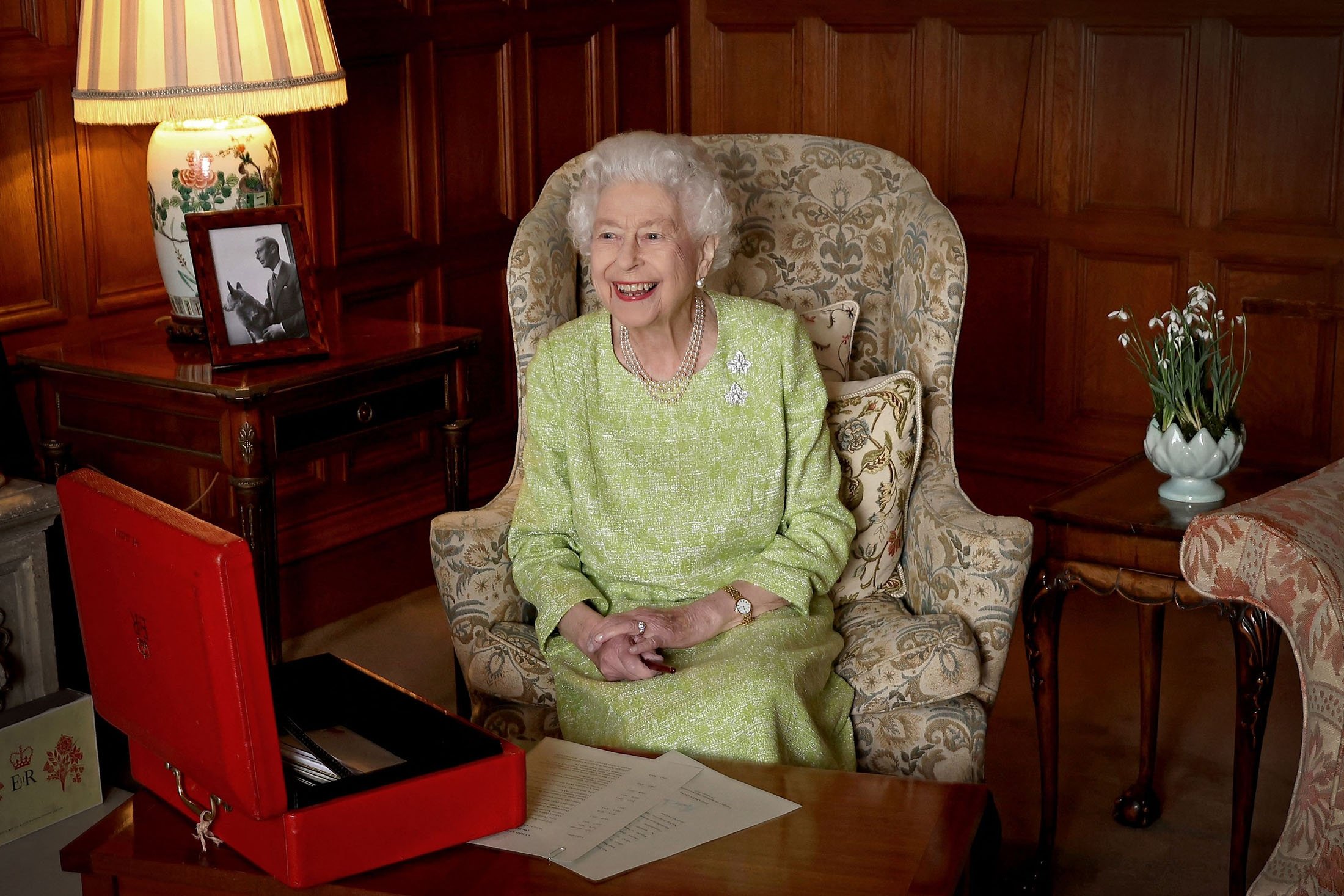 Queen Elizabeth II smiles as she sits in Sandringham House in Norfolk, U.K., Feb. 2, 2022. (Buckingham Palace via AFP)
