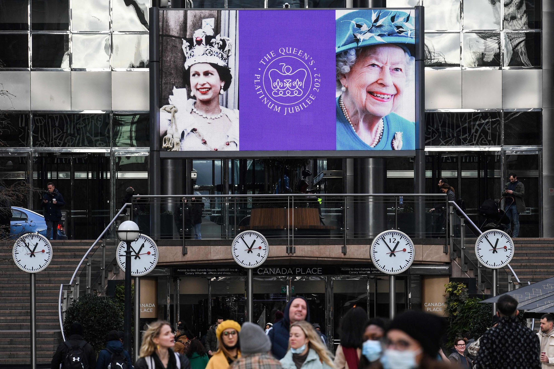 Images of Britain's Queen Elizabeth II are displayed on a digital screen at the Canary Wharf district, in London, U.K., Feb. 6, 2022. (AFP Photo)