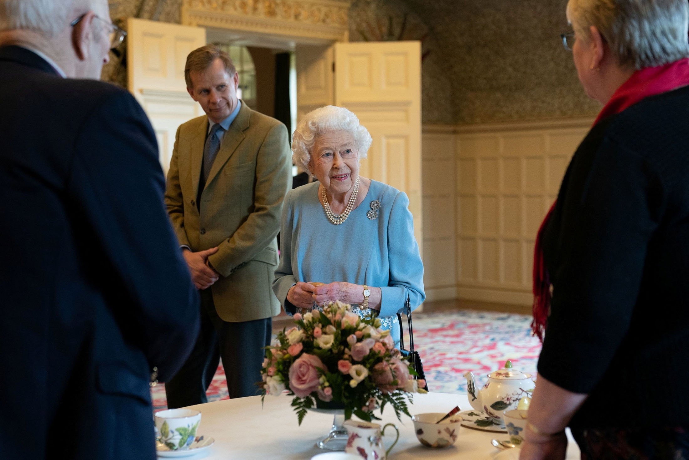 Britain's Queen Elizabeth talks to pensioners from the Sandringham Estate during a reception at the Ballroom of Sandringham House, the Queen's residence in Norfolk, U.K., Feb. 5, 2022. (Reuters Photo)