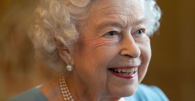 Britain's Queen Elizabeth II smiles during a reception in the Ballroom of Sandringham House, the Queen's residence in Norfolk, U.K., Feb. 5, 2022. (AFP Photo)