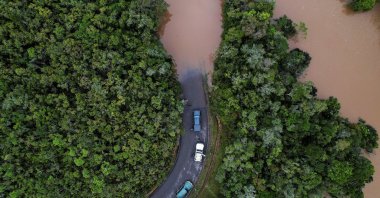 Cars stop before a flooded area, after Cyclone Batsirai made landfall, on a road in Vohiparara, Madagascar, Feb. 6, 2022. (Reuters Photo)