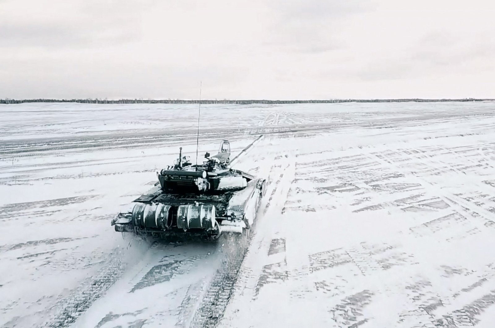 This handout video grab taken and released by the Russian Defense Ministry shows a tank on a snow-covered field during joint exercises of the armed forces of Russia and Belarus as part of an inspection at Brestsky firing range in Belarus, Feb. 2, 2022. (AFP Photo/Russian Defense Ministry)