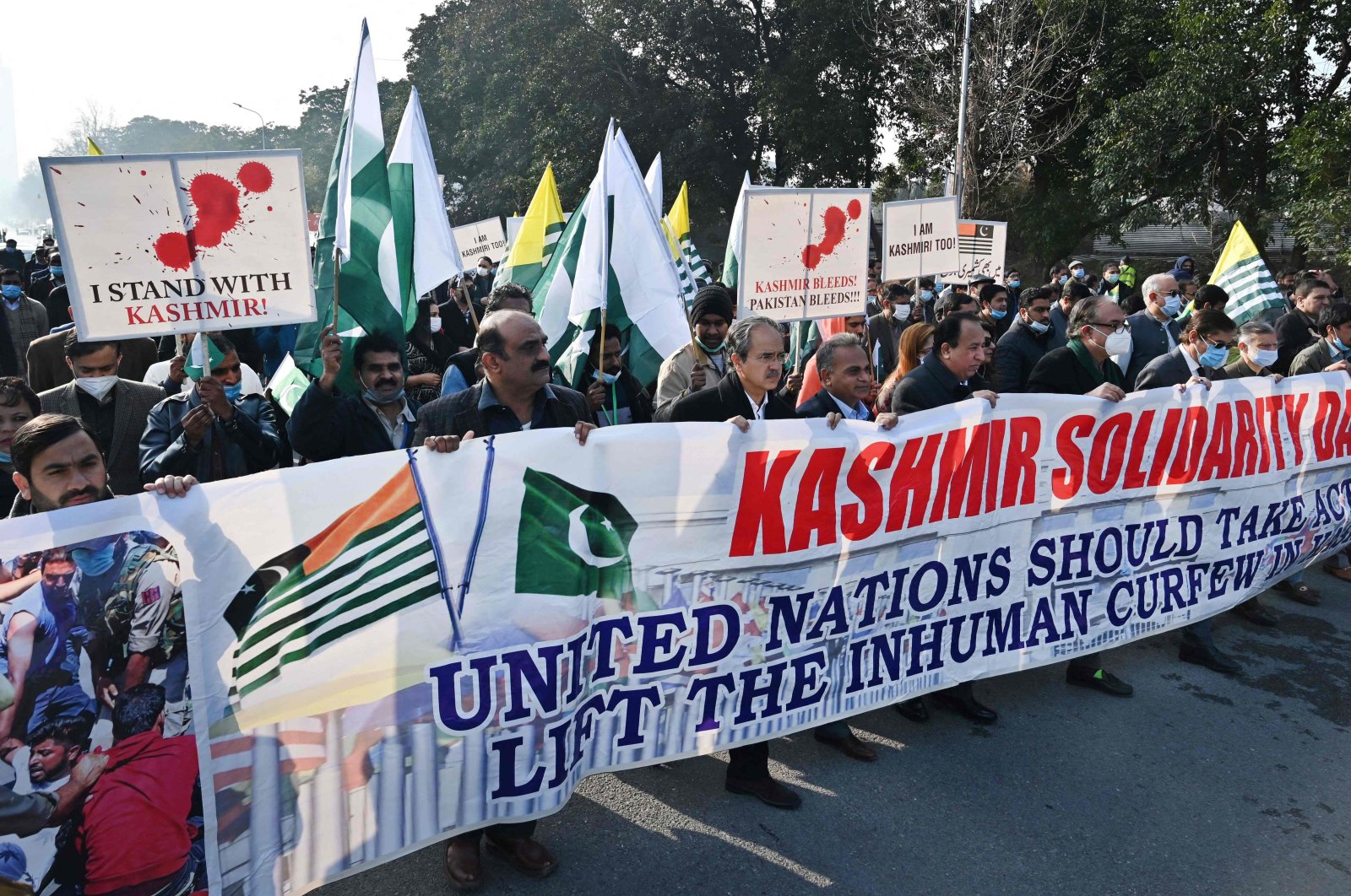 People carry a banner during a rally to mark Kashmir Solidarity Day in Islamabad, Pakistan, Feb. 5, 2022. (AFP Photo)