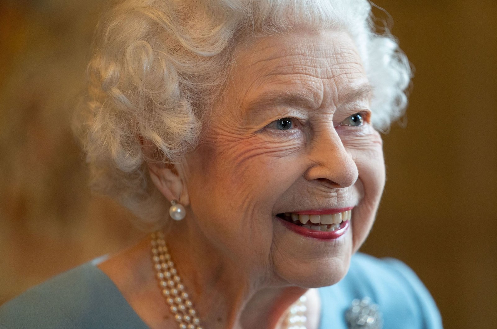 Britain&#039;s Queen Elizabeth II smiles during a reception in the Ballroom of Sandringham House, the Queen&#039;s residence in Norfolk, U.K., Feb. 5, 2022. (AFP Photo)