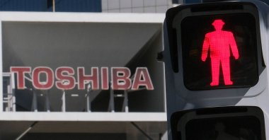 The logo of Japanese industrial group Toshiba is seen on top of a building at its headquarters in Tokyo, Japan, Feb. 7, 2022. (AFP Photo)