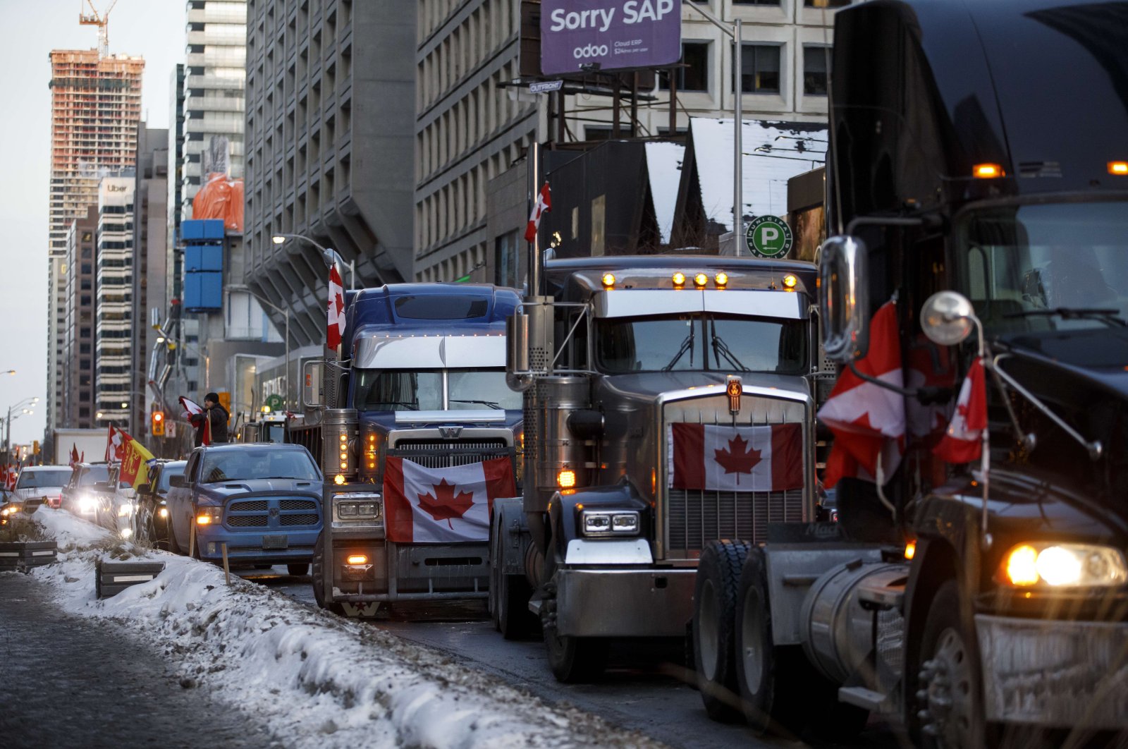 Trucks line a street in Bloor near Yorkville, Toronto, Canada, Feb. 5, 2022. (Getty Images via AFP)