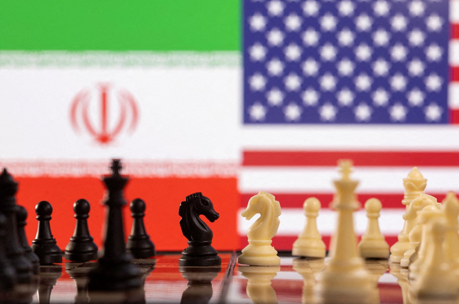 Chess pieces are seen in front of displayed Iran&#039;s and U.S. flags in this illustration taken Jan. 25, 2022. (Reuters Photo)