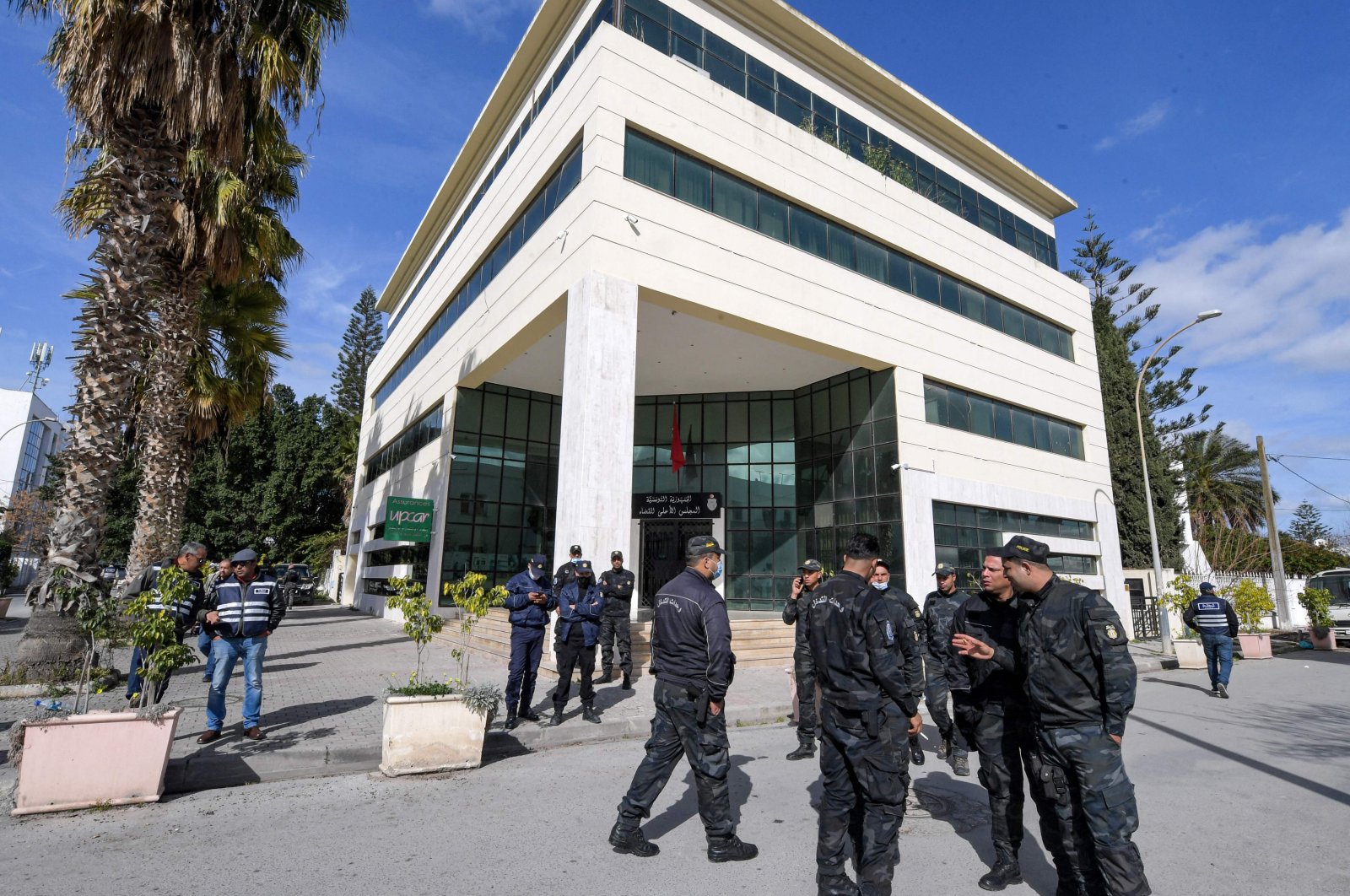 Members of the Tunisian security forces stand outside the closed headquarters of Tunisia&#039;s Supreme Judicial Council (CSM) in the capital Tunis, Tunisia, Feb. 6, 2022. (AFP Photo)