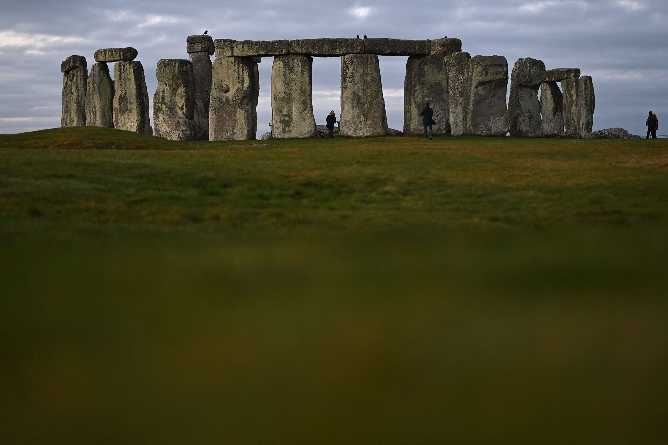 People visit the prehistoric monument Stonehenge near Amesbury, southern England, Jan. 19, 2022. (AFP Photo)