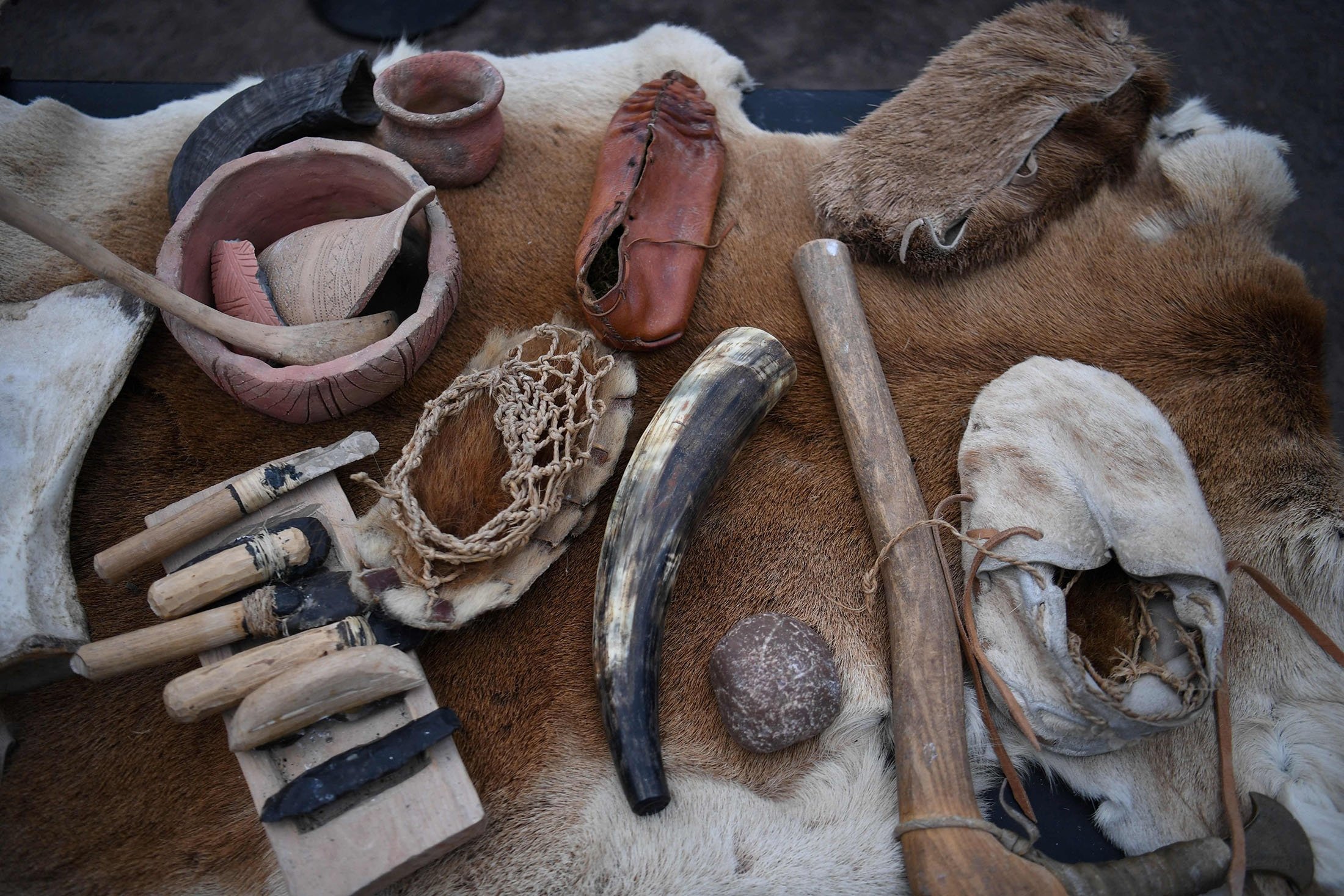 A display showing a recreation of the tools historians believe people used to live, is pictured at the visitor centre at Stonehenge near Amesbury, southern England, Jan. 19, 2022. (AFP Photo)