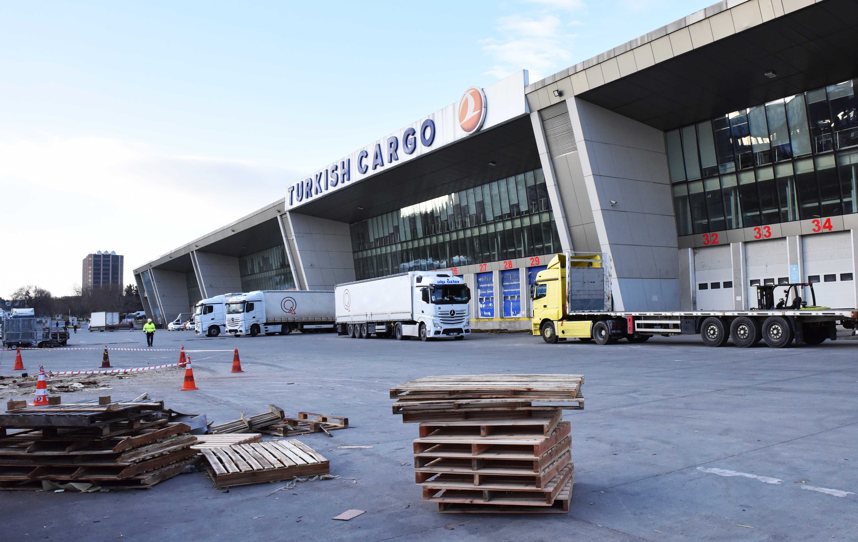 Trucks wait to be loaded at Atatürk Airport with equipment of Turkish Cargo before being transported to Istanbul Airport, Turkey, Feb. 5, 2022. (Turkish Cargo via AA)