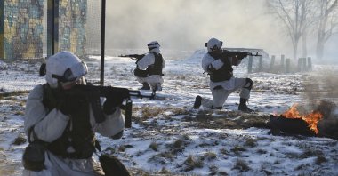 In this photo provided by the Russian Defense Ministry Press Service, Russian soldiers attend a military exercise at the Golovenki training ground in the Moscow region, Russia, Jan. 25, 2022. (Photo via AP)