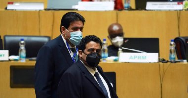 Head of the transitional presidential council of Libya Younes Menfi (R) arrives to attend the 35th Ordinary Session of the African Union (AU) Summit in Addis Ababa, Ethiopia, Feb. 5, 2022. (AFP Photo)