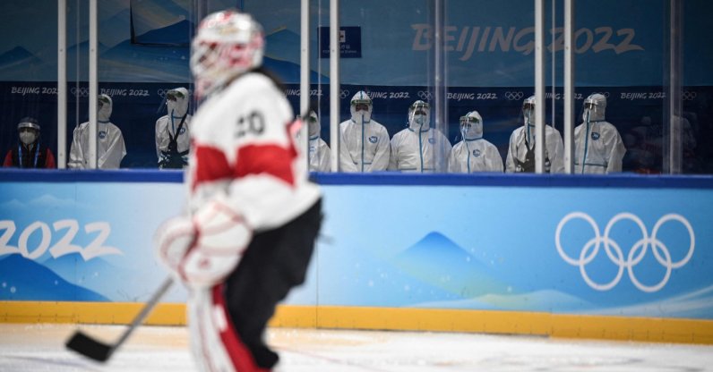 Staff in PPE sit at a medical station during the women's Beijing 2022 Winter Olympic Games ice hockey match Canada and Switzerland, Beijing, China, Feb. 3, 2022. (AFP Photo)