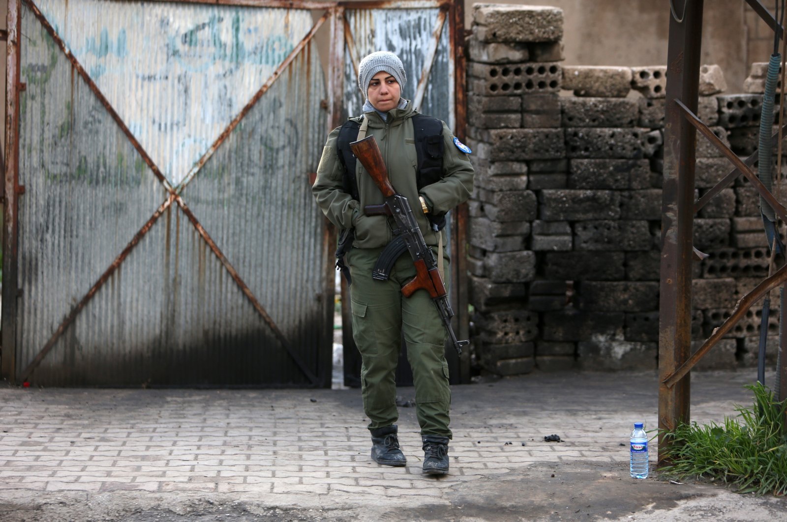 A YPG/PKK terrorist walks in Qamishli, Syria March 30, 2019. (Reuters File Photo)