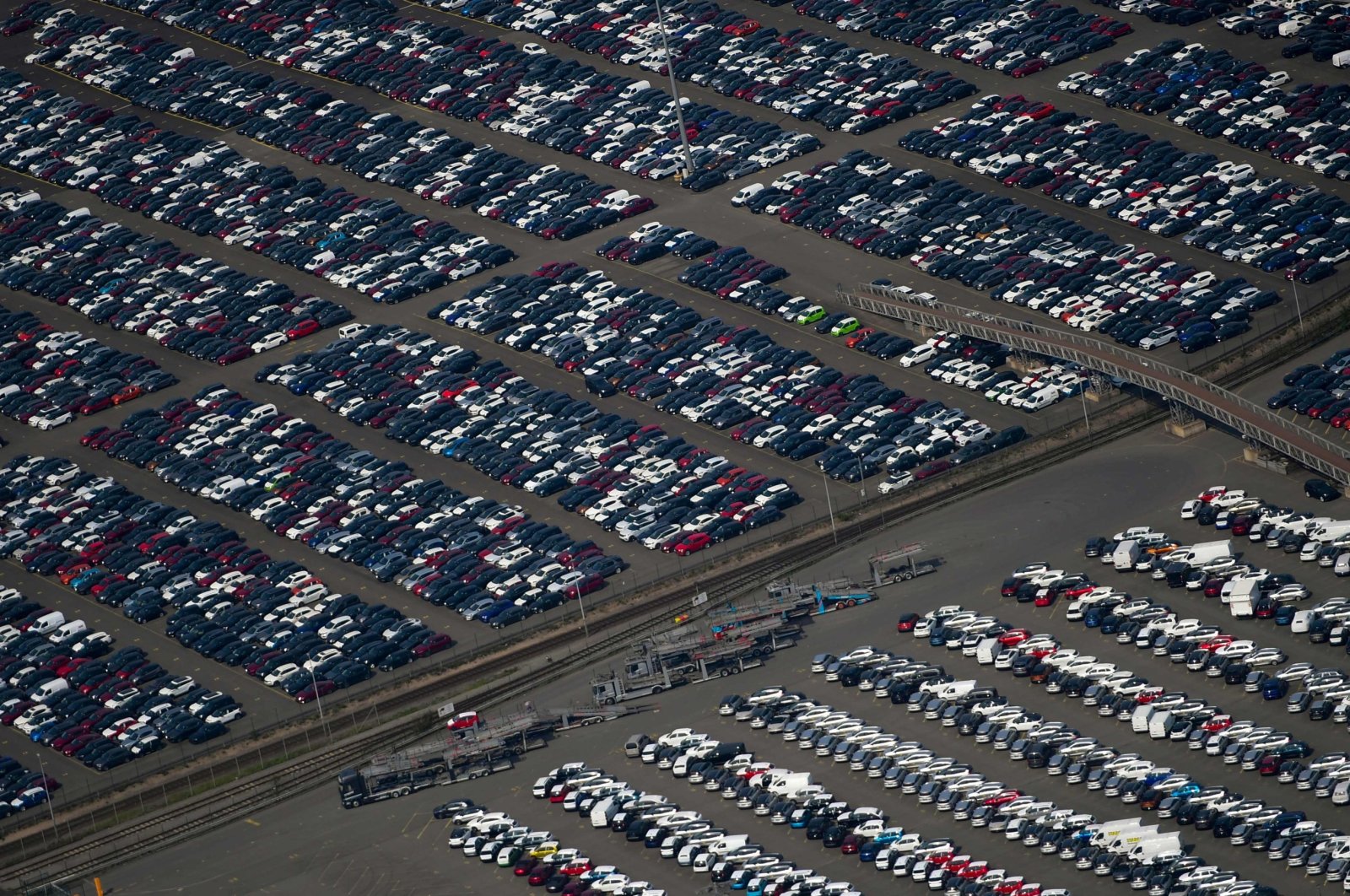 This aerial file photo shows new cars for sale parked at the harbor of Duisburg, western Germany, May 8, 2020. (AFP Photo)