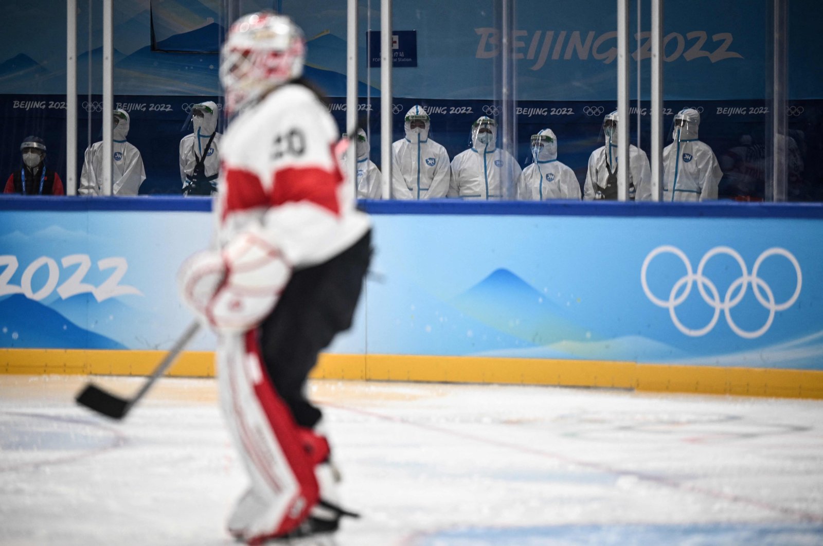 Staff in PPE sit at a medical station during the women&#039;s Beijing 2022 Winter Olympic Games ice hockey match Canada and Switzerland, Beijing, China, Feb. 3, 2022. (AFP Photo)