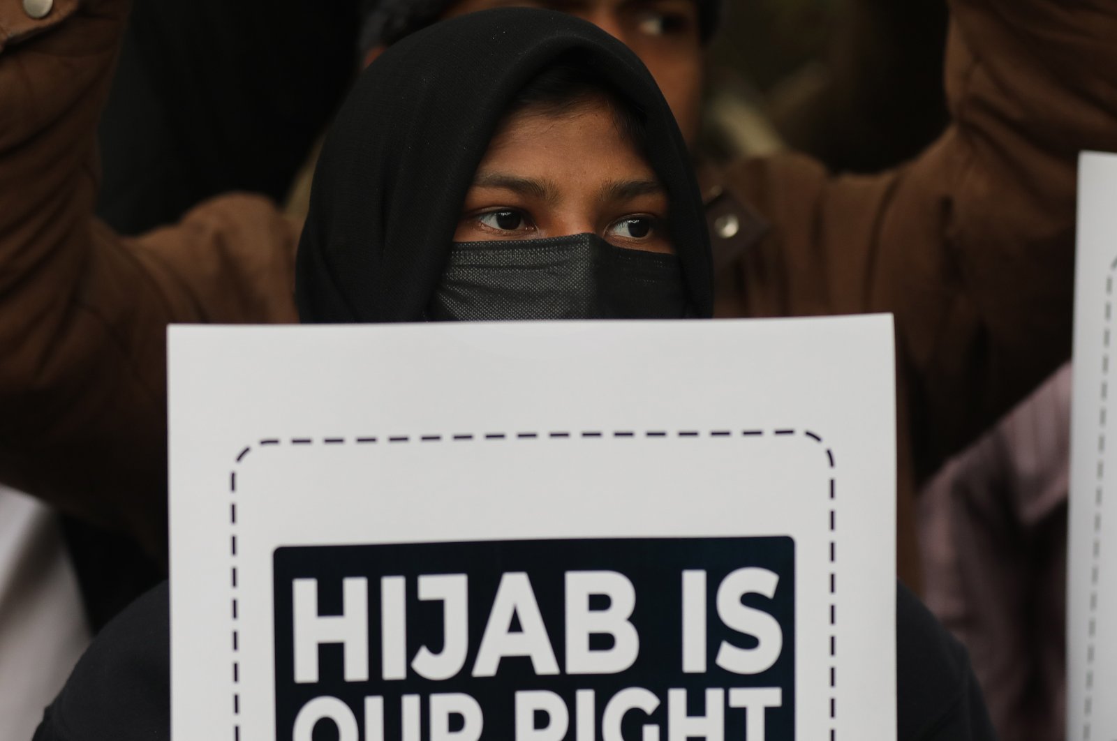 Indian student activists from Muslim Students Federation (MSF) hold placards during a protest against hijab (headscarf) restriction, in New Delhi, India, 08 February 2022. (EPA Photo)