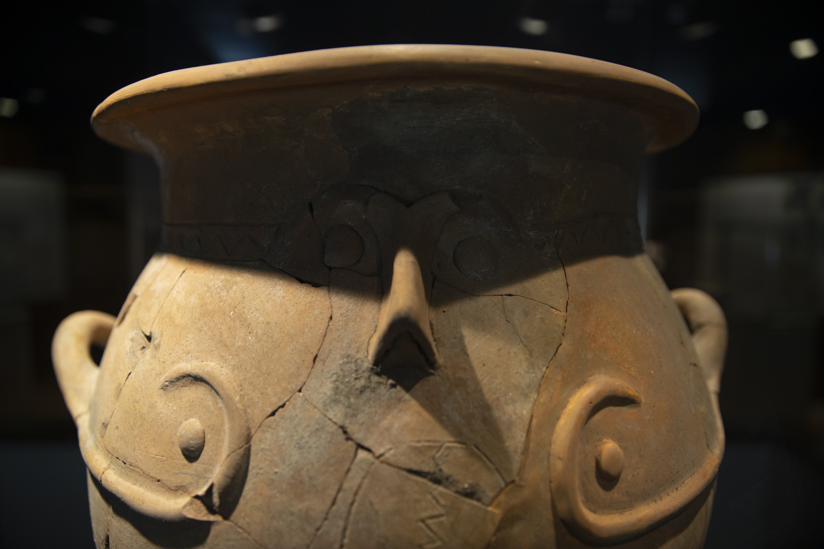A close-up of an item of pottery featuring a depiction of a human face at Izmir Archaeology Museum, western Turkey, Feb. 8, 2022. (AA)