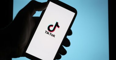 TikTok logo on a phone display. (AA Photo) 