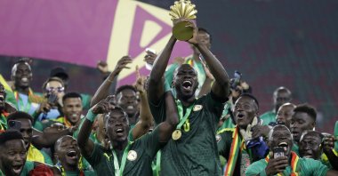 Senegal players celebrate with the AFCON trophy, Yaounde, Cameroon, Feb. 6, 2022. (AP Photo)