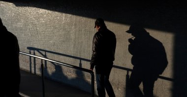 A man walks and smokes in Istanbul, Turkey, March 12, 2011. (Shutterstock Photo)