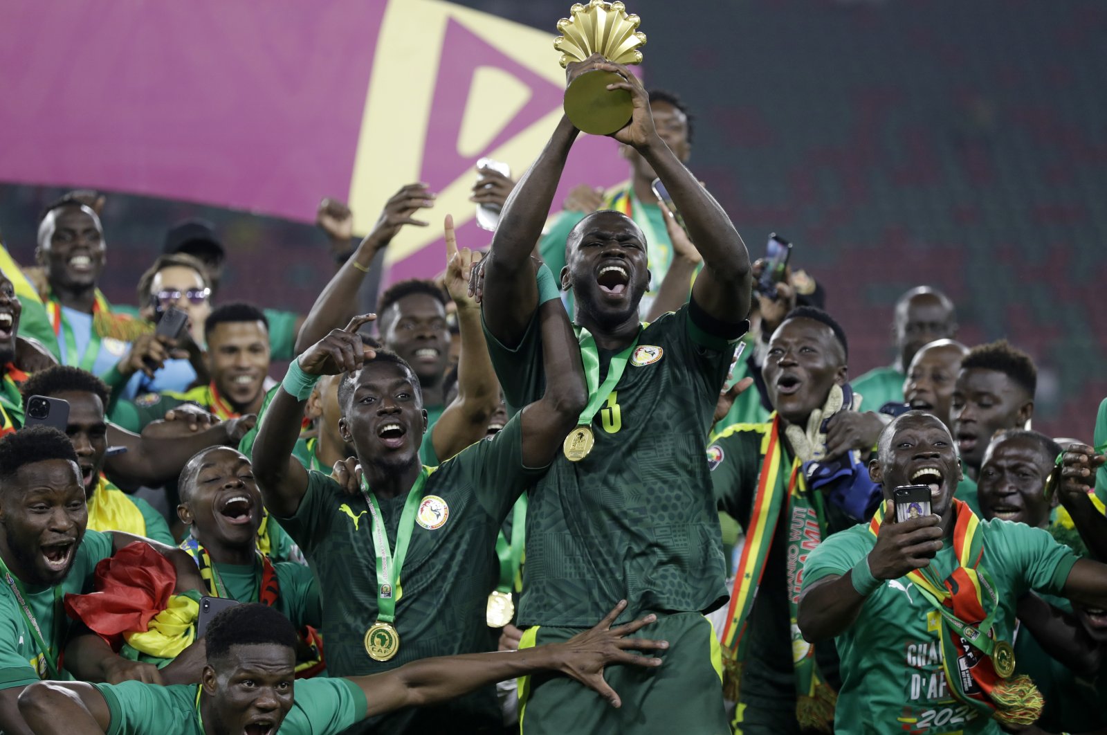 Senegal players celebrate with the AFCON trophy, Yaounde, Cameroon, Feb. 6, 2022. (AP Photo)