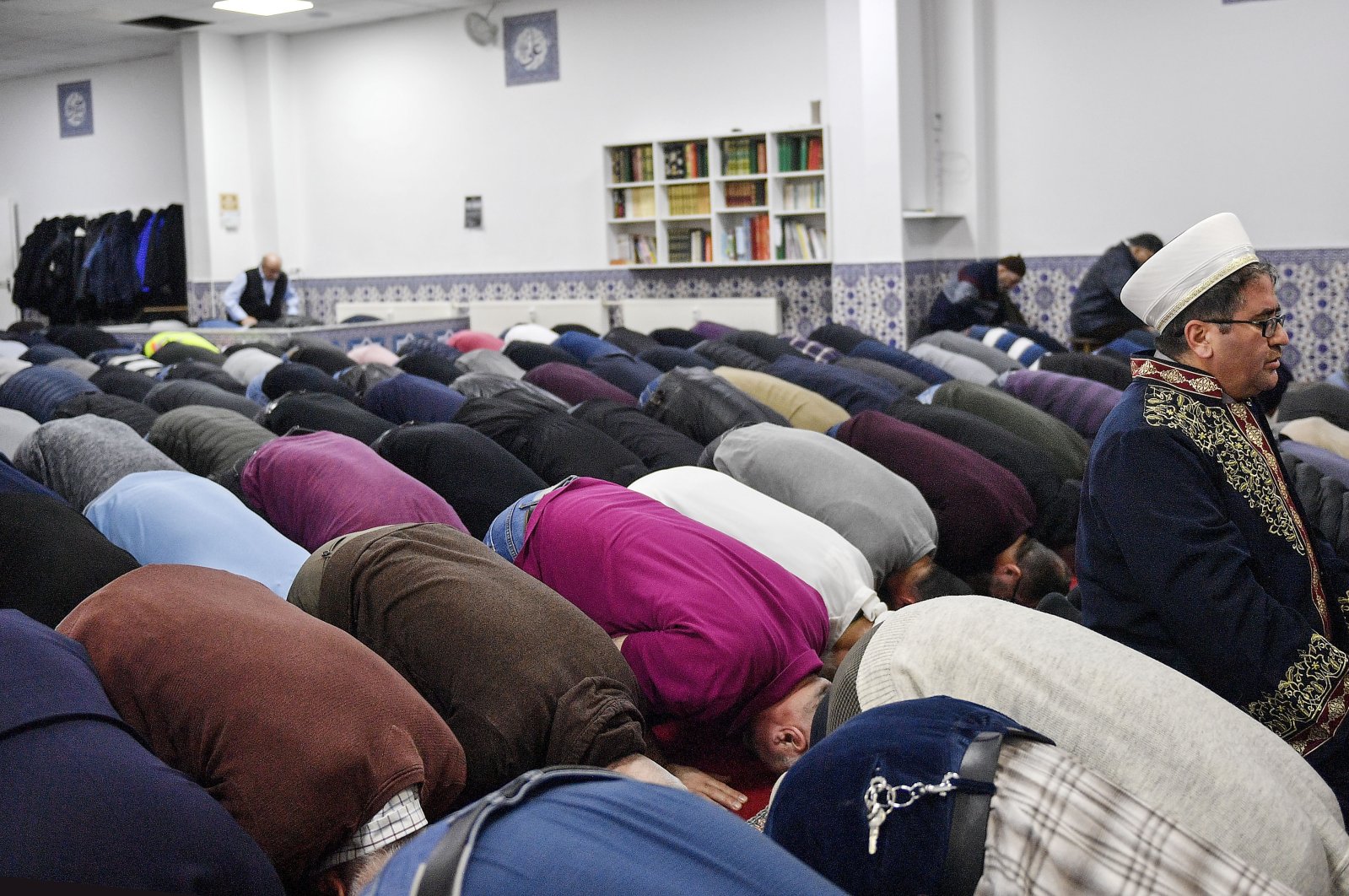 Muslim believers pray in a mosque for the victims of the shooting in Hanau, Germany, Feb. 21, 2020. (AP File Photo)
