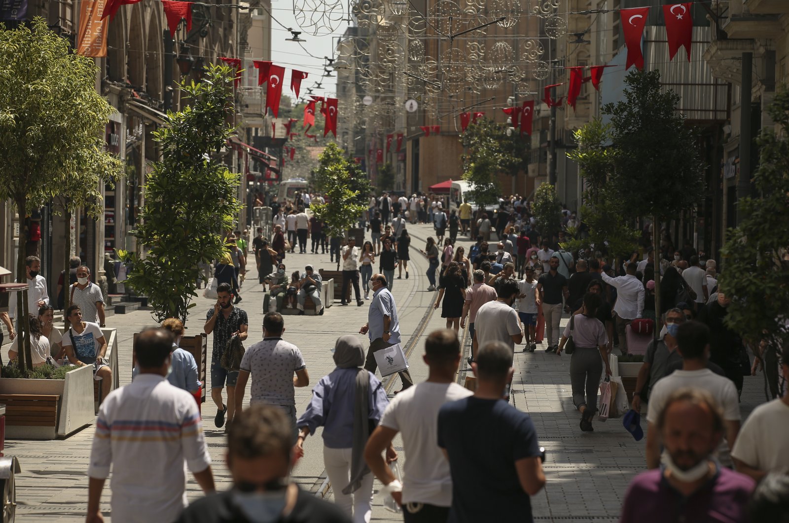 People walk on Istiklal Avenue, the main shopping street in Istanbul, Turkey, July 1, 2021. (Reuters Photo)