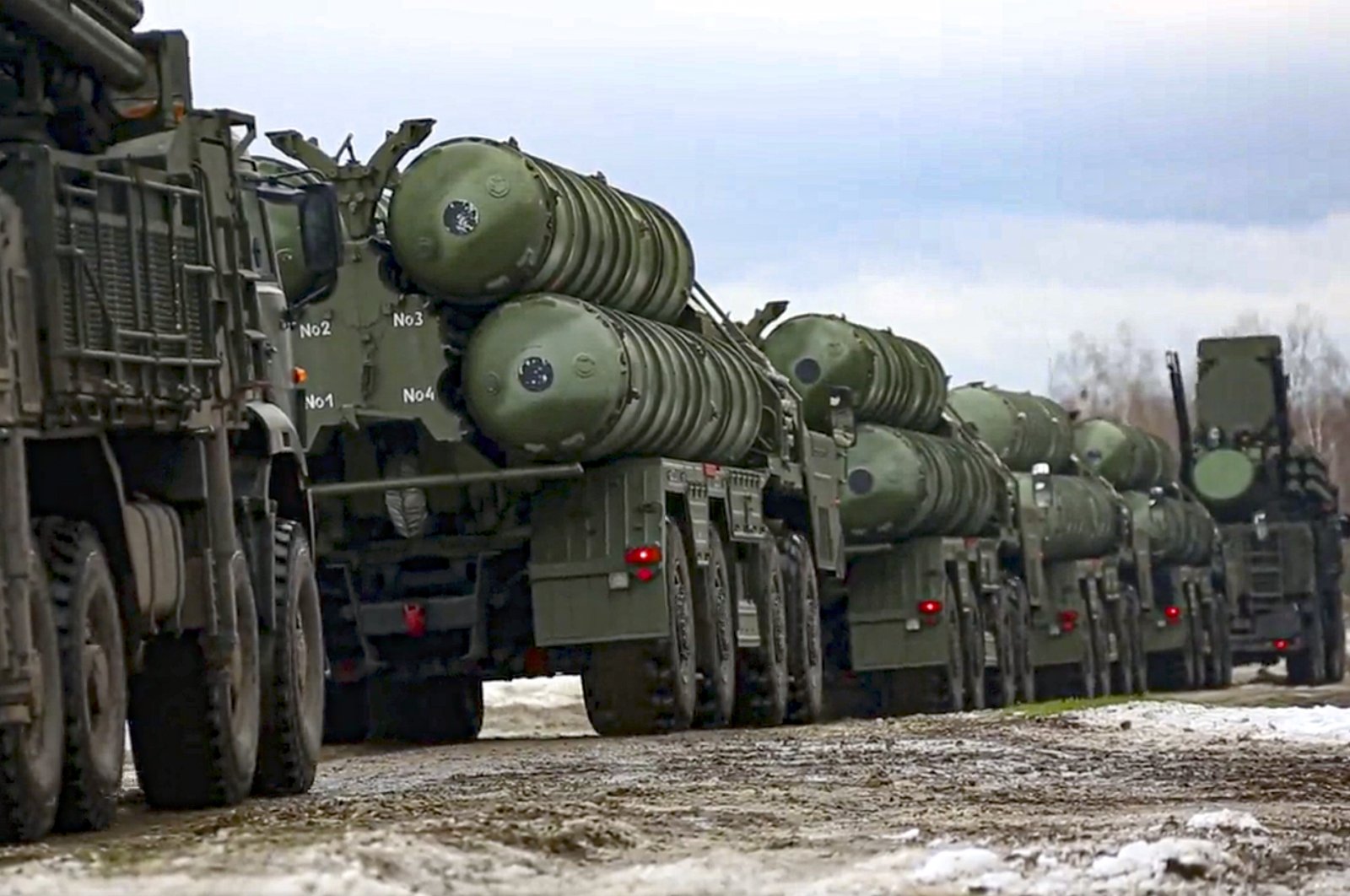 In this photo taken from video provided by the Russian Defense Ministry Press Service on Feb. 10, 2022, Combat crews of the S-400 air defense system drive to take up combat duty at the training ground in the Brest region during the Union Courage-2022 Russia-Belarus military drills in Belarus. (AP Photo)