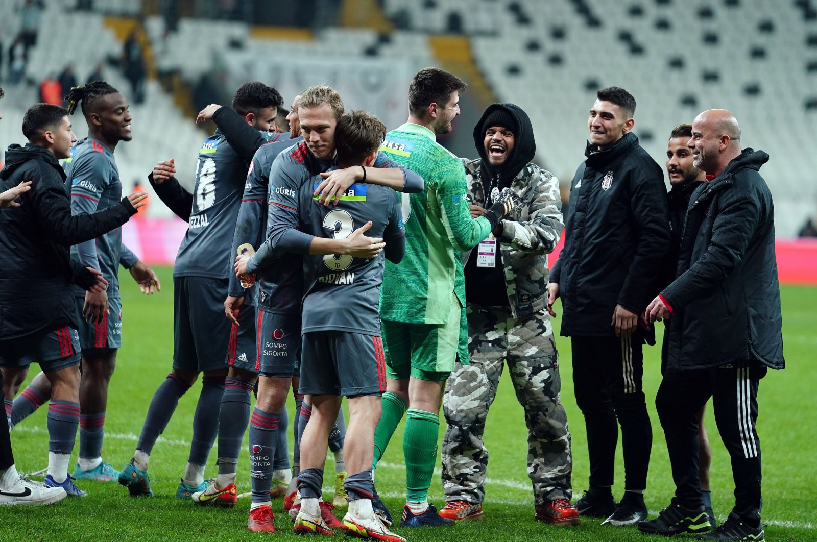 Beşiktaş players celebrate the victory during the Turkish Cup Round of 16 match at the Vodafone Park in Istanbul on Feb. 11, 2022 (AA Photo)