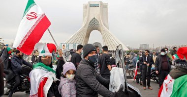 Iranians take part in a rally marking the 43rd anniversary of the 1979 Islamic Revolution, at the Azadi (Freedom) square in Tehran, Iran, Feb. 11, 2022. (Photo by AFP)
