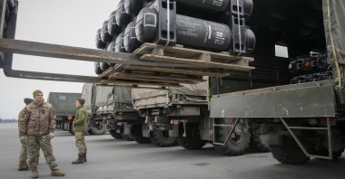 Ukrainian soldieres load Javelin anti-tank missiles, delivered as part of the United States security assistance to Ukraine, into military trucks at the Boryspil Airport, outside Kyiv, Ukraine, Feb. 11, 2022. (AP Photo)