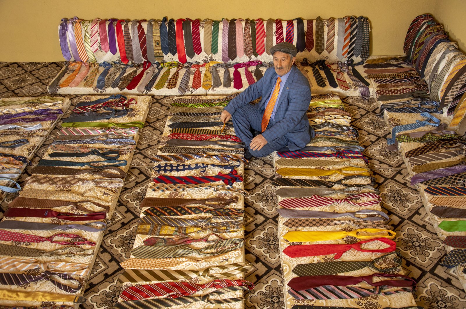 Bedir Akbulut poses with his tie collection, in Van, eastern Turkey, Feb. 11, 2022. (AA PHOTO) 