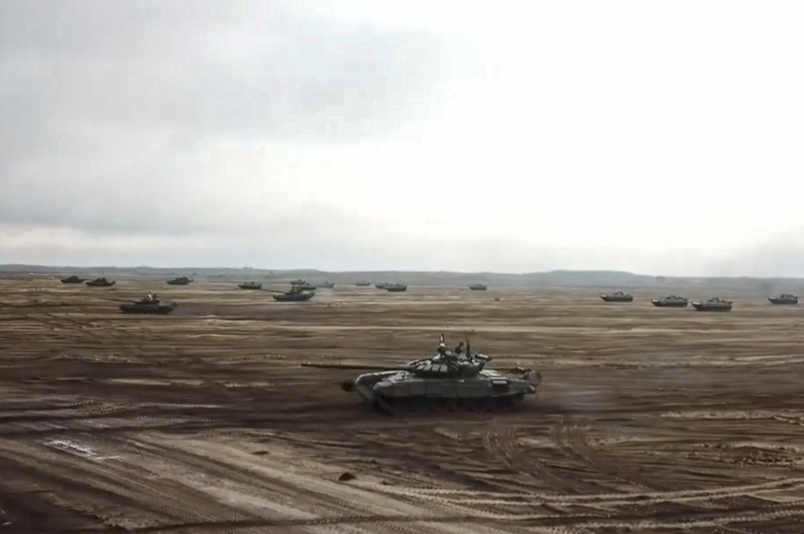 A still image from a handout video shows Russian and Belarusian tanks taking part in the joint operational exercise &quot;Union Courage-2022&quot; of the armed forces of Belarus and Russia, at a firing range in the Brest region, Belarus, Feb. 11, 2022. (EPA via Russian Defense Ministry Press Service Handout)