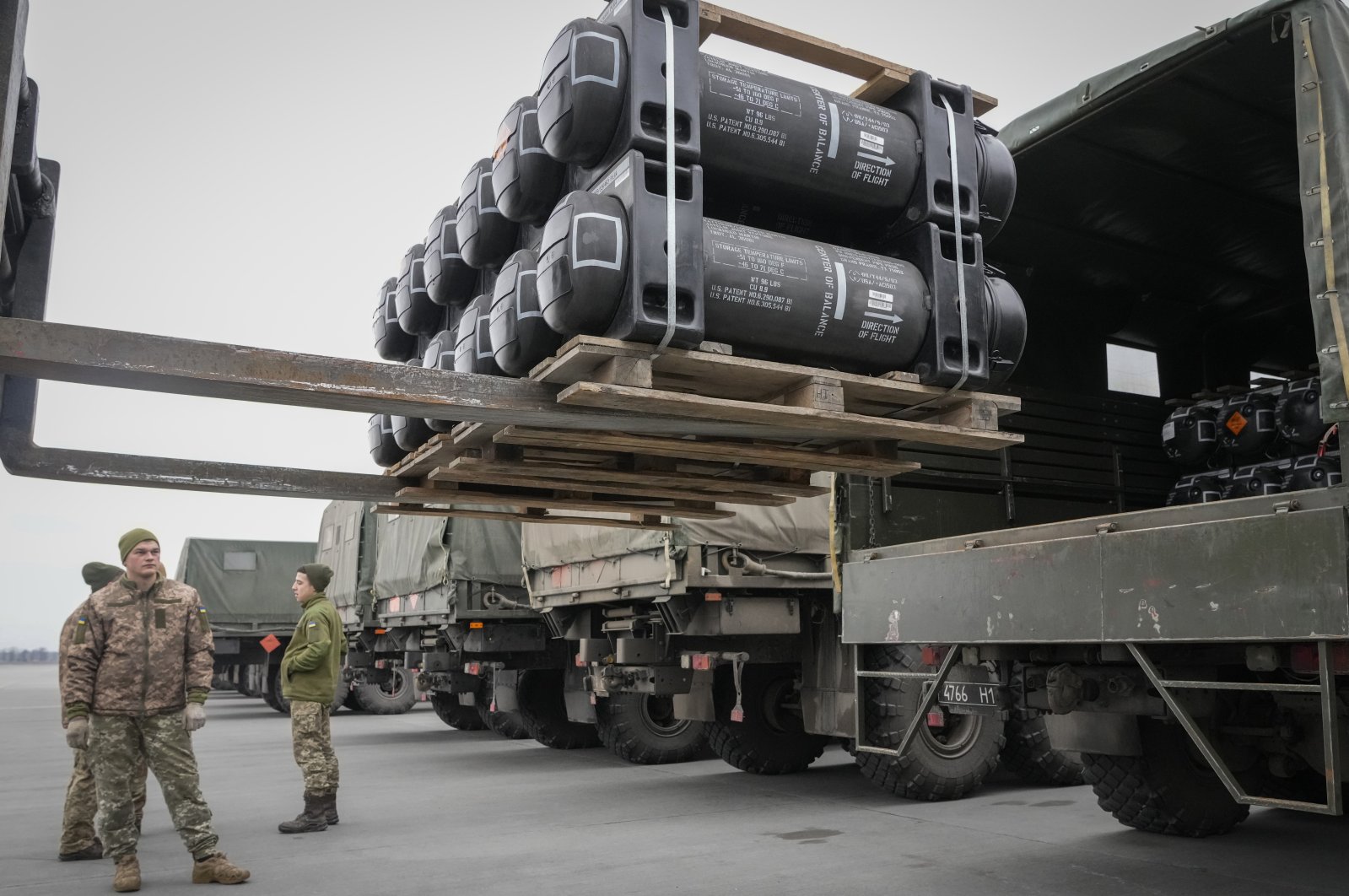 Ukrainian soldieres load Javelin anti-tank missiles, delivered as part of the United States security assistance to Ukraine, into military trucks at the Boryspil Airport, outside Kyiv, Ukraine, Feb. 11, 2022. (AP Photo)