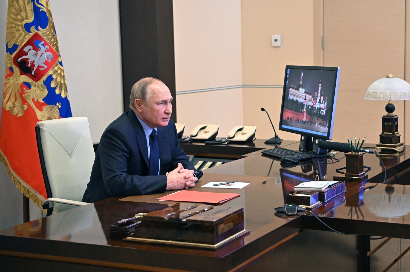 Russian President Vladimir Putin chairs a meeting with members of the Security Council via teleconference call, at the Novo-Ogaryovo state residence, outside Moscow, Russia, Feb. 11, 2022. (AFP Photo)