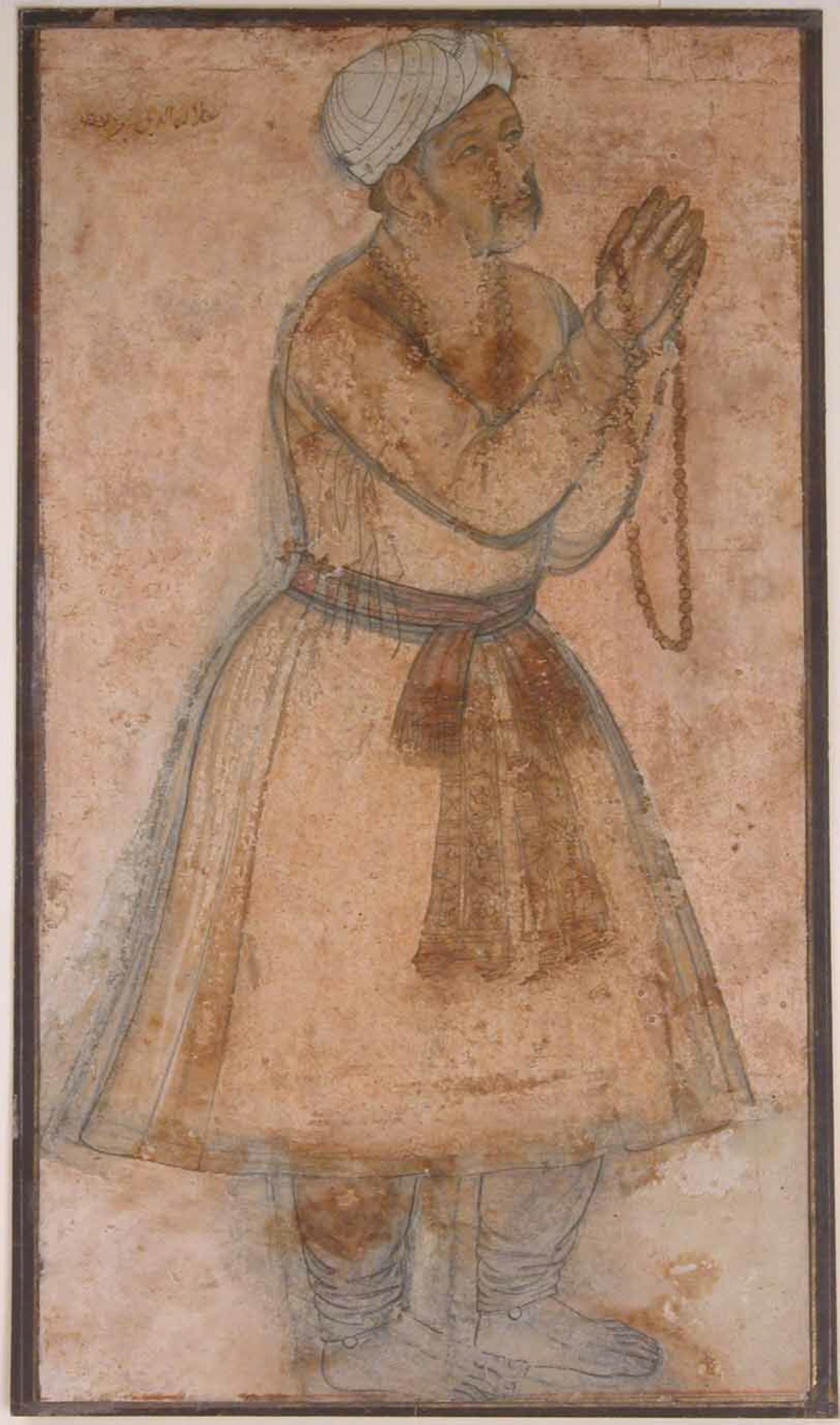 A miniature portrait shows Akbar I praying. (Wikimedia)