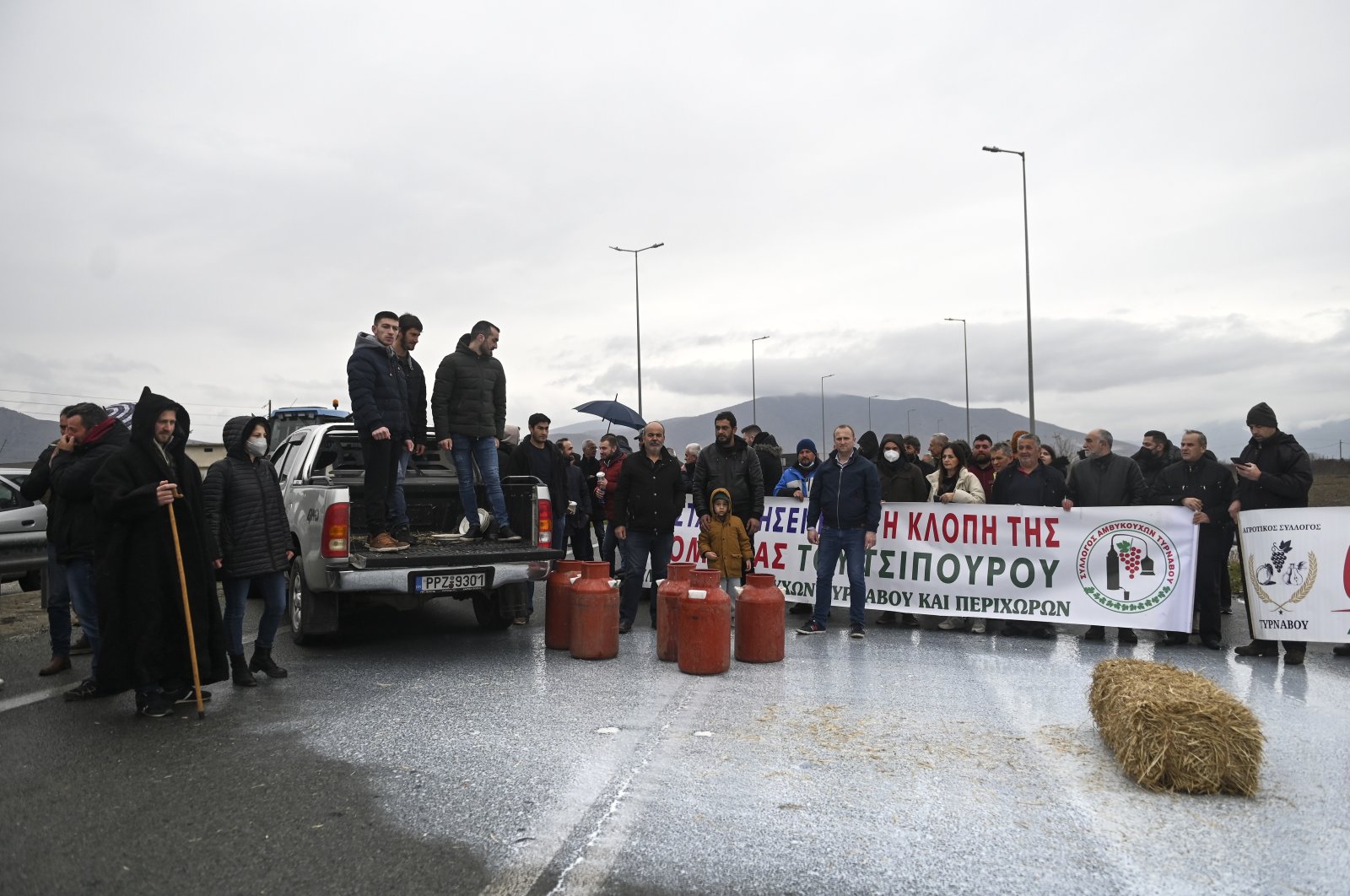 Greek farmers stage a protest on a motorway, near the town of Larissa, central Greece, Feb. 13, 2022. (AP Photo)
