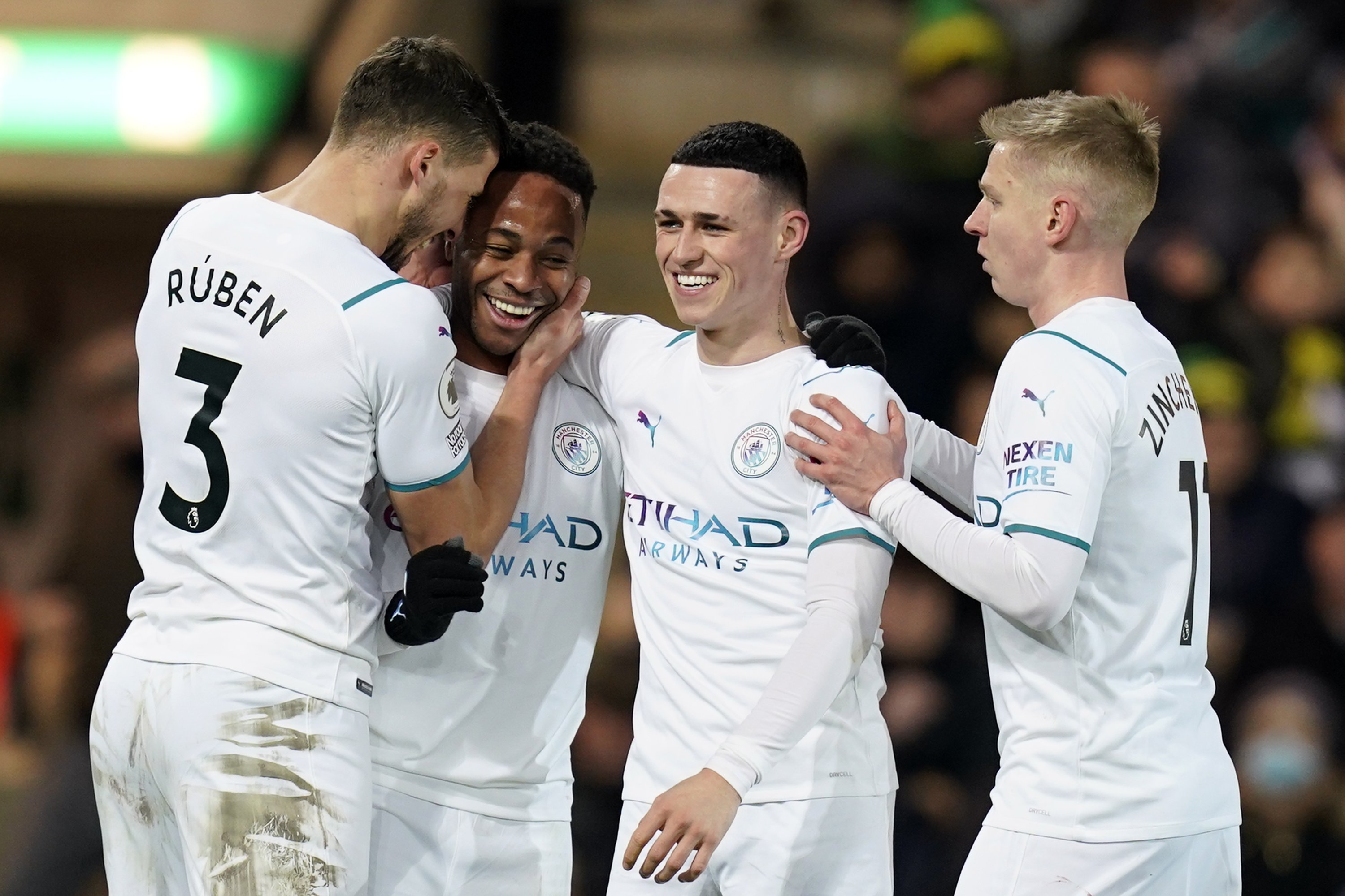 Manchester City's Raheem Sterling (2nd L) is congratulated by (From L to R) teammates Ruben Dias, Phil Foden and Oleksandr Zinchenko after scoring in a Premier League game against Norwich City, Norwich, England, Feb. 12, 2022. (EPA Photo)