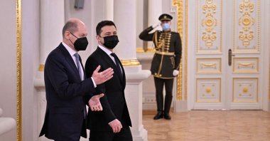 This handout picture taken and released by the Ukrainian presidential press service shows President Volodymyr Zelenskyy (2ndL) welcoming German Chancellor Olaf Scholz ahead of their meeting in Kyiv, Ukraine, Feb. 14, 2022. (Ukraine presidency via AFP)