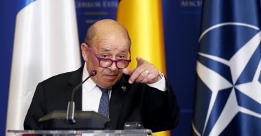 Jean-Yves Le Drian, French minister for Europe and Foreign Affairs, accompanied by the Romanian Foreign Minister, gestures before answering a journalist's question at the end of a common statement that followed their B9 meeting held at Foreign Ministry headquarters in Bucharest, Romania, Feb. 3, 2022. (EPA Photo)